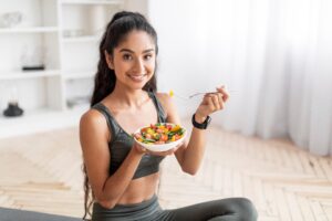Woman eating heathy foods after CoolSculpting to maintain results in Scarsdale, NY